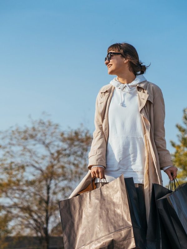 young-woman-is-standing-car-with-bags-her-hands_1153-5793